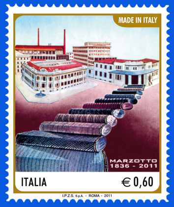Francobollo commemorativo del 2011 dedicato alla Marzotto, con illustrazione dello stabilimento e rotoli di tessuto in primo piano, simbolo dell’eccellenza tessile italiana dal 1836.<br /><br /><br /><br /><br /><br /><br /><br />